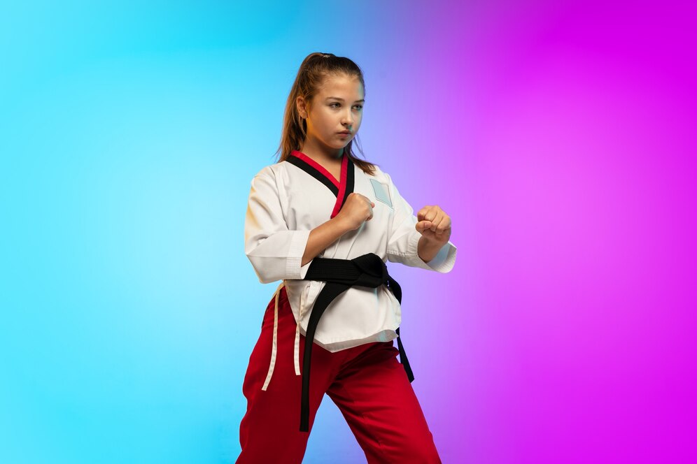A young girl practicing martial arts. Source: Freepik