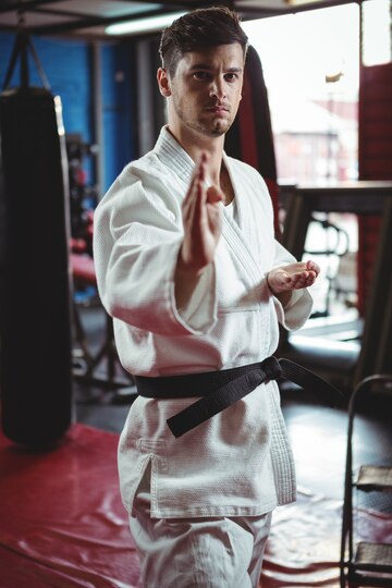 A man in martial arts pose.
Source: Freepik