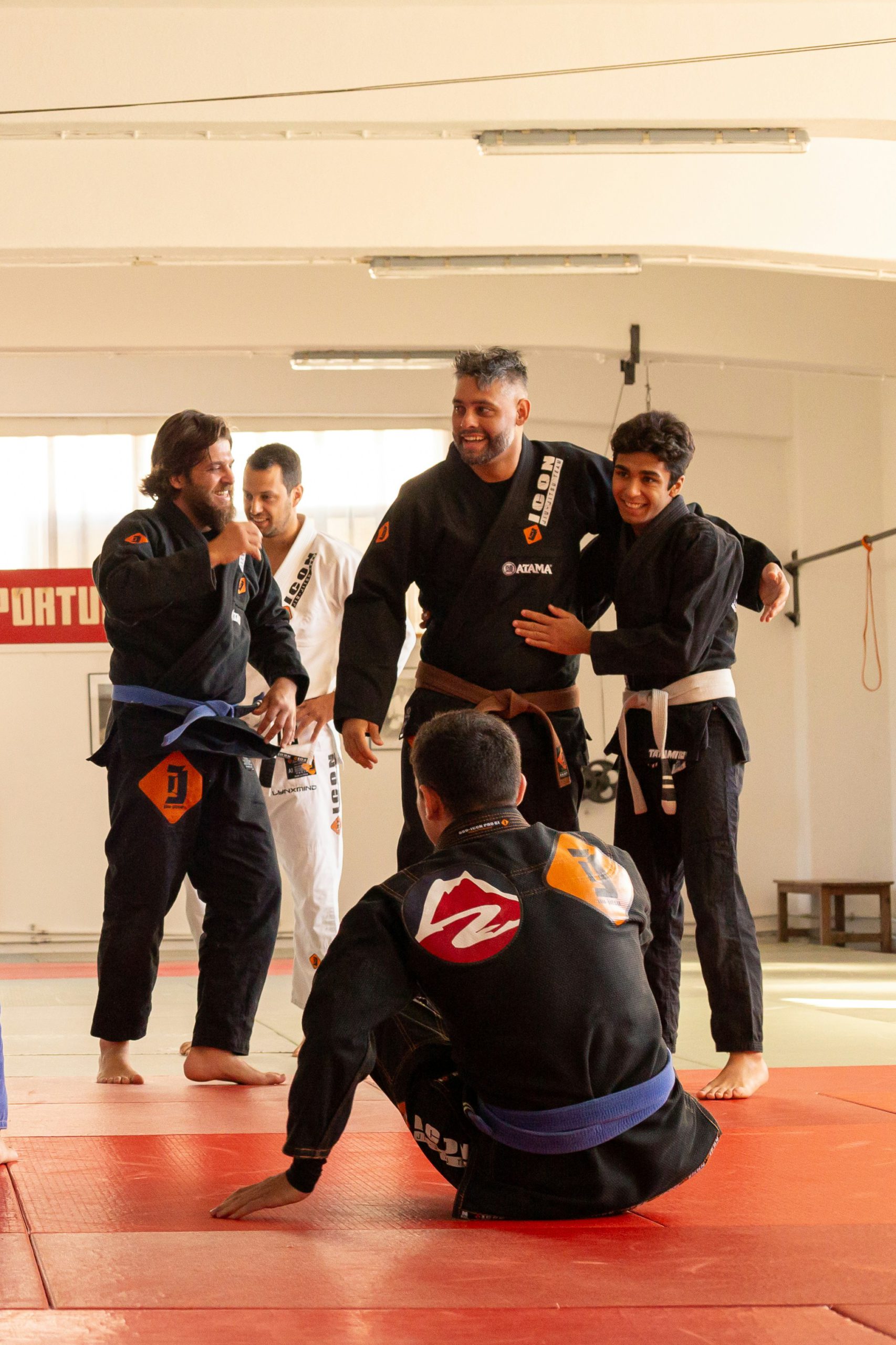 The instructor congratulating his students in a martial arts school.