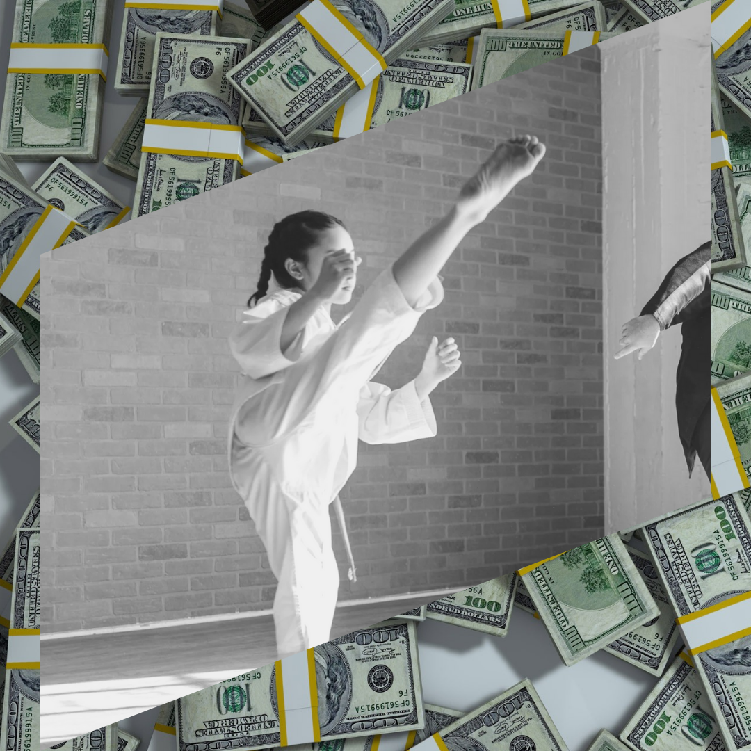 A young girl training martial arts on a dollar banknotes background.