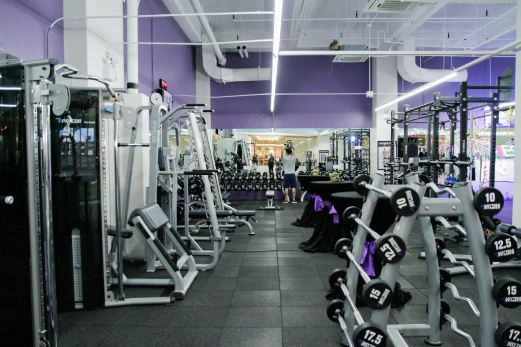 An empty gym with its owner, waiting for customers