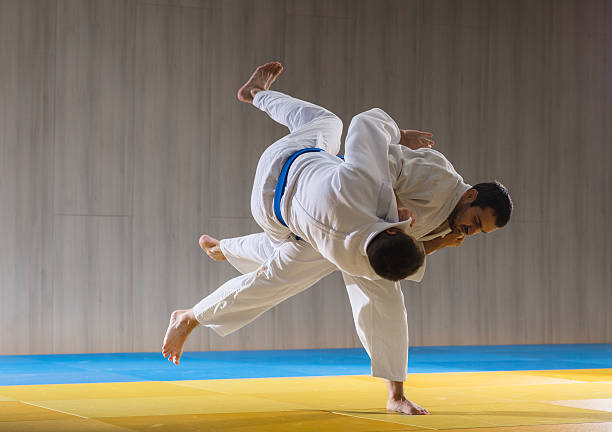 Two men fighting in judo style. Source: Freepik