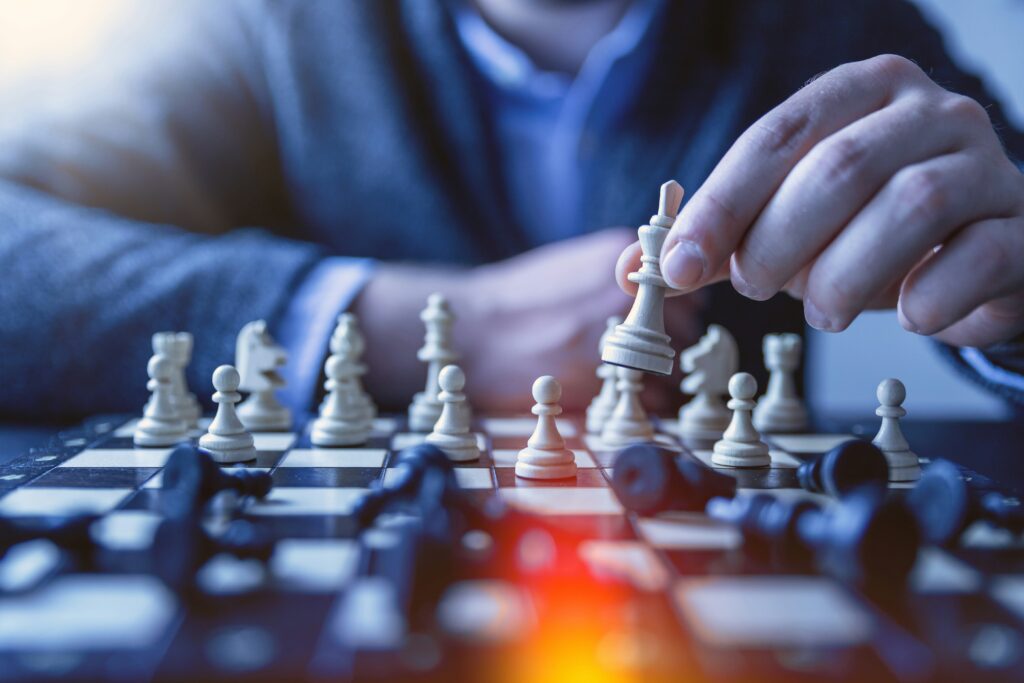 Man playing chess symbolizing social media strategy in gyms, which are planning their business well.