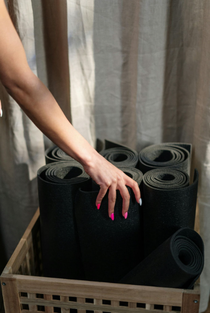 A few black yoga mats, one of the most important equipment