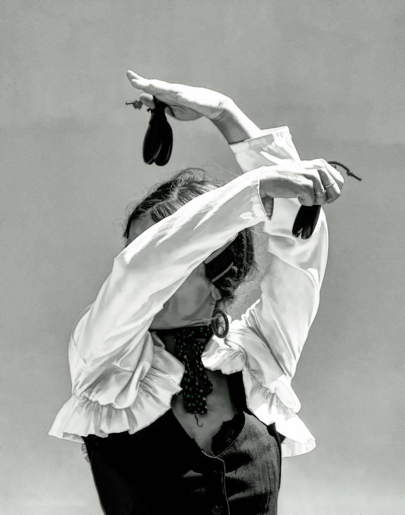 Flamenco dancer with castanets - one of the small instruments used during dancing