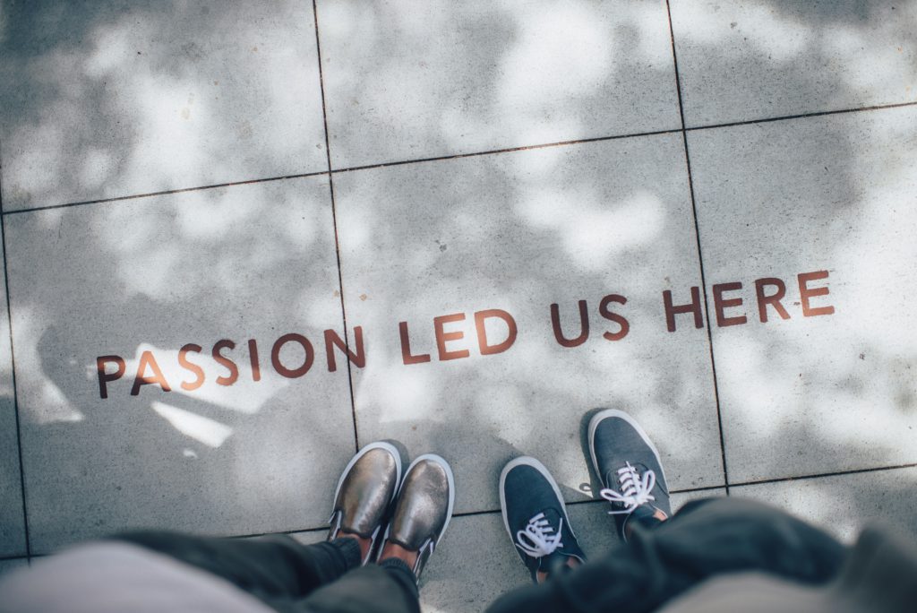 A slogan “Passion led us here” to describe life goals of the dance studio owners.