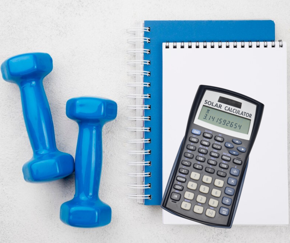 Dumbbells and next to them: notebooks and a calculator - things needed to calculate taxes in a fitness club.