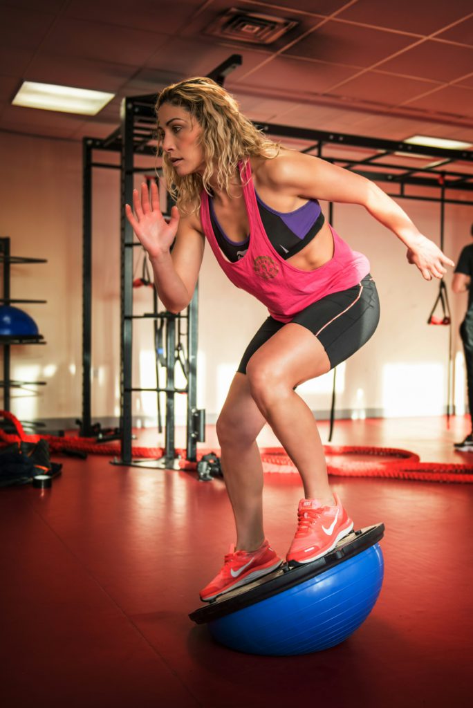 A woman practicing body balance.