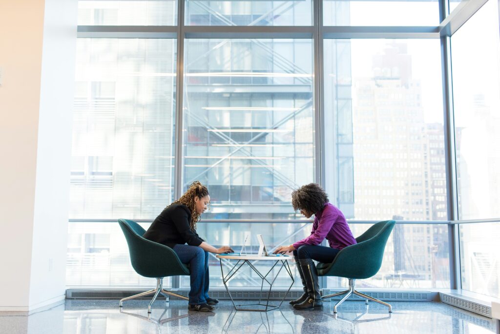 A gym owner is talking with a fitness consultant about hiring requirements, job description, salary and other important factors.