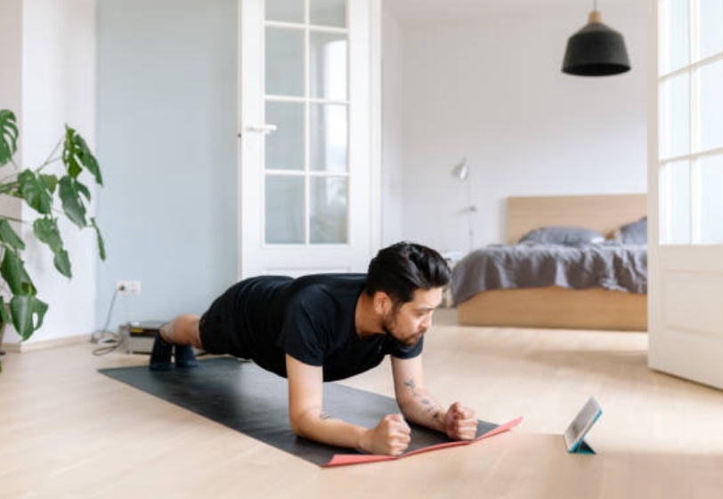 A man having online strength training.