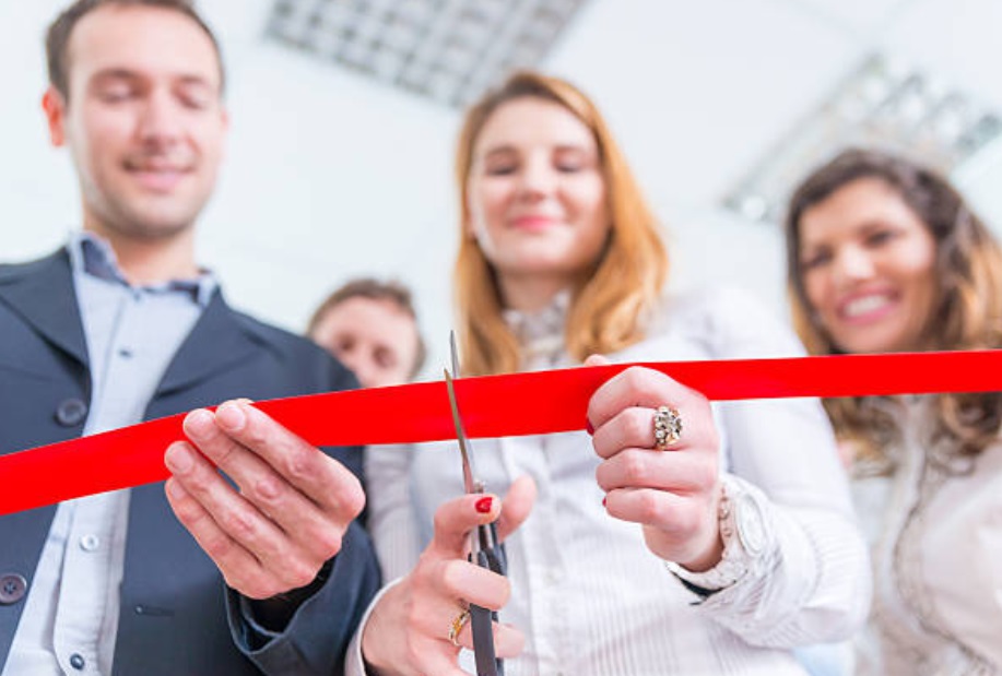 Ribbon cut as one of the elements of gym events during the grand opening.