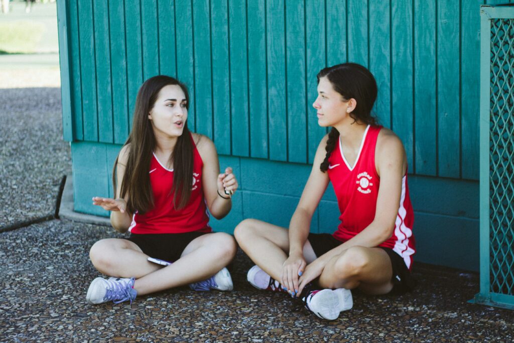 A trainer explaining something to an athlete.