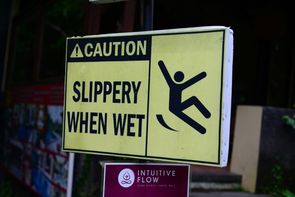 A sign about slippery floors is one of health and safety protocols.