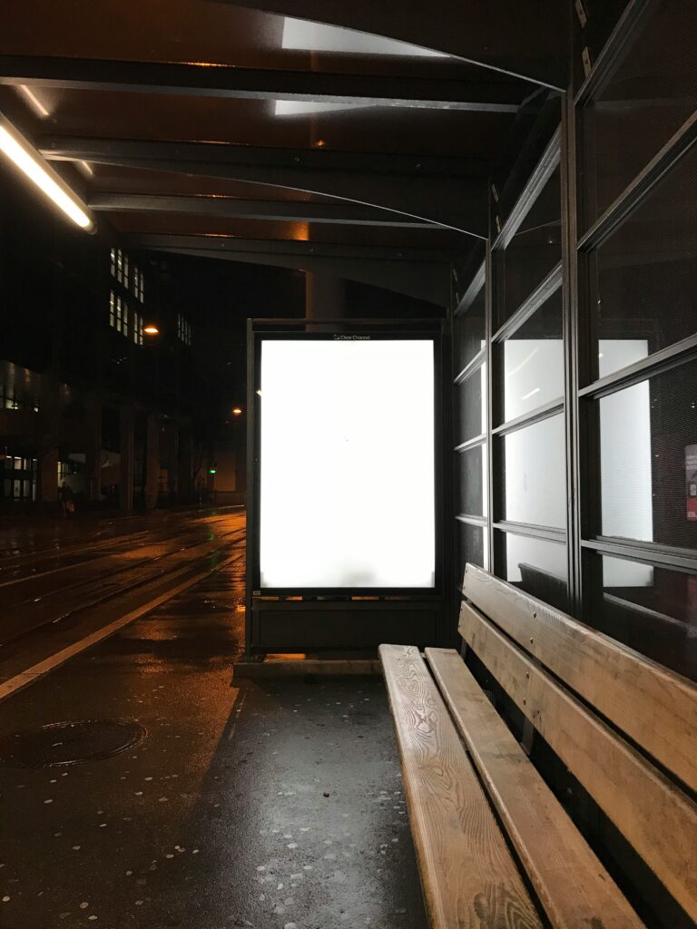 Empty illuminated place at the bus stop, symbolizing space for gym advertising.