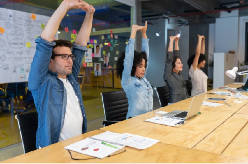 A moment of fitness training: stretching between labor tasks.