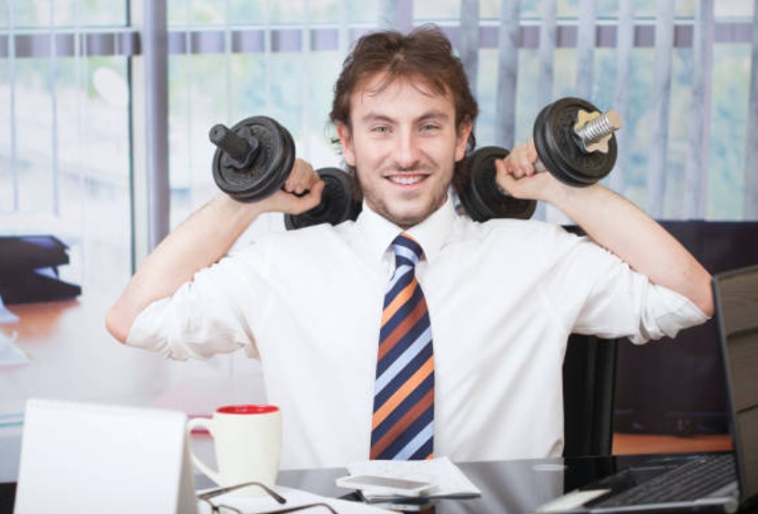 A gym manager in a business outfit.