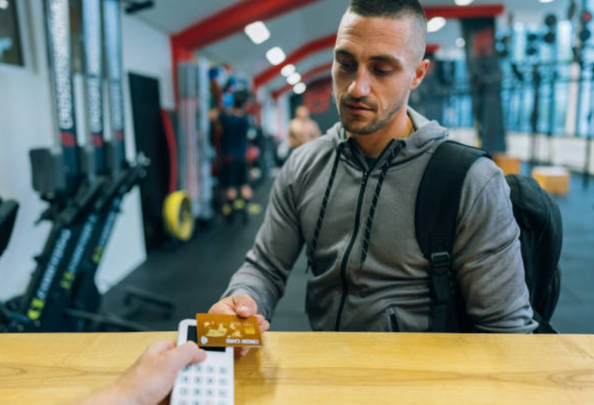 A customer paying for gym membership.