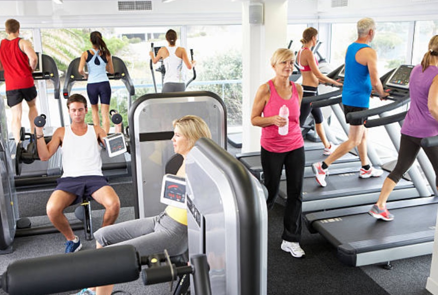 A crowded gym during a busy time.