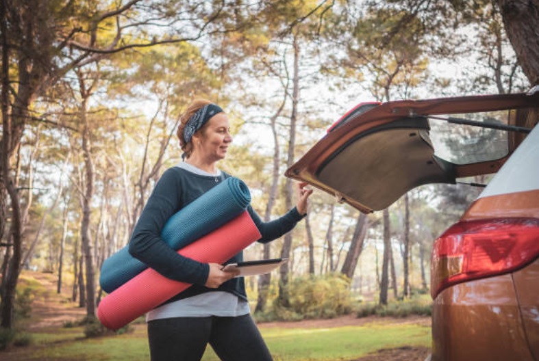 A yoga teacher running her mobile fitness business.