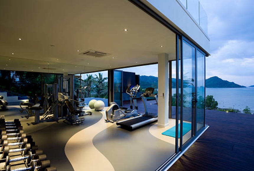 A fitness center with a precious view and a luxurious interior.