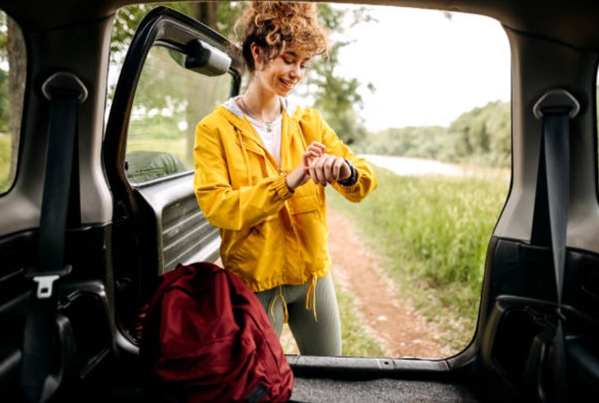 An instructor running a mobile fitness business, waiting for her clients for outdoor exercise.