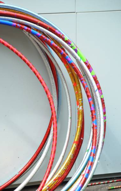 The hula hoop is a symbol of circus art but also a great accessory for fitness class themes.