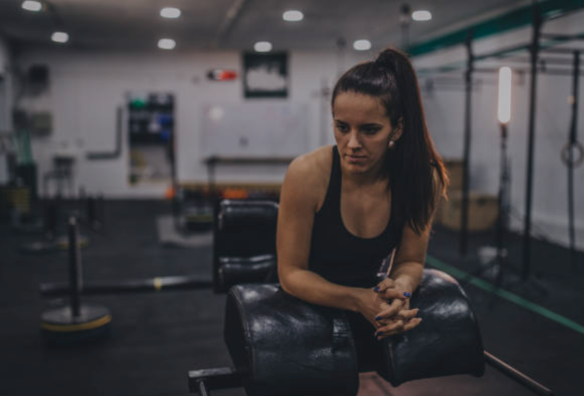 The saddened gym owner, forced to close her business.