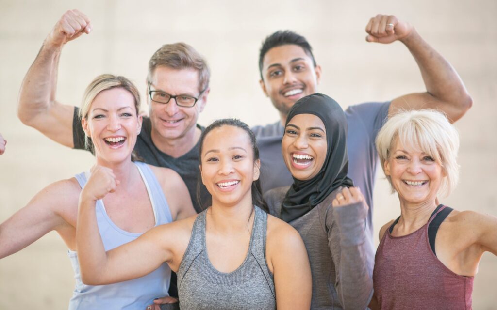 Group members workout ideas at gym