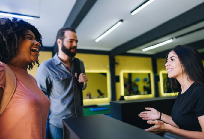 This gym layout is a good example of placing the reception desk. And the receptionist is a perfect example of the positive first impression maker.