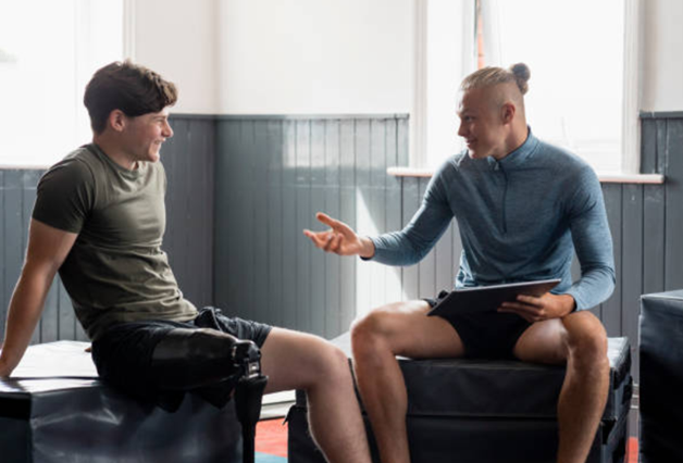 A personal trainer’s body language is an example of non verbal communication which also matters a lot. Here, a friendly supportive relation is shown.