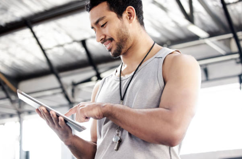 A trainer managing class schedules in a gym management software system.